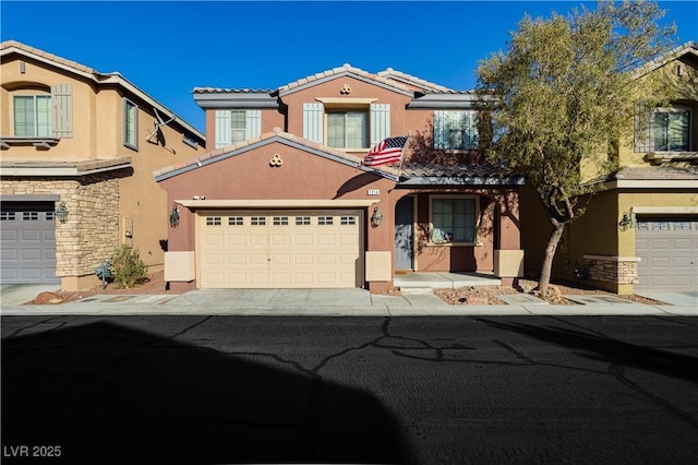 view of front facade featuring a garage, stone siding, driveway, and stucco siding