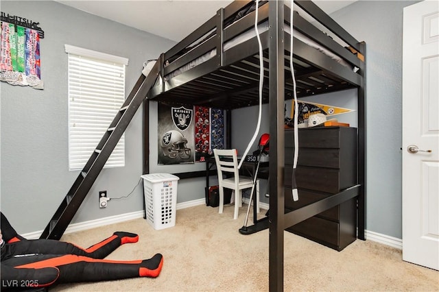 carpeted bedroom with baseboards