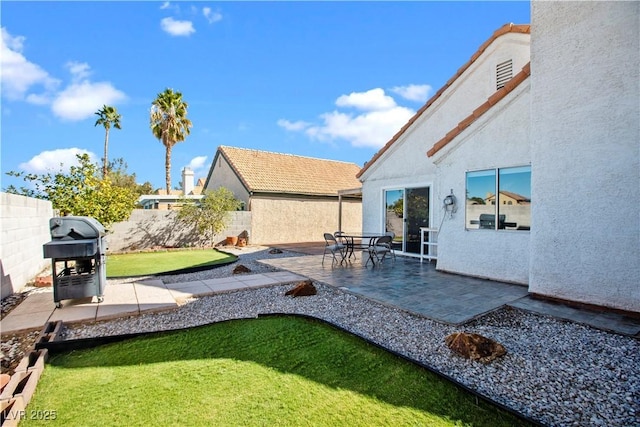 view of yard featuring a patio area and a fenced backyard