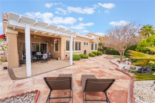 view of patio / terrace with outdoor dining space, a pergola, and a ceiling fan