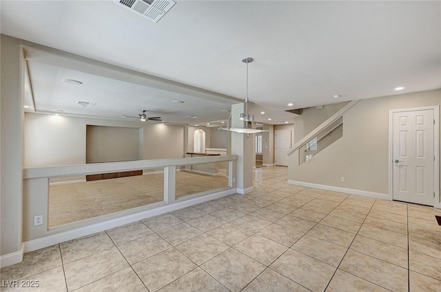 unfurnished room featuring light tile patterned floors, visible vents, ceiling fan, stairs, and recessed lighting