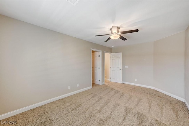 interior space featuring light carpet, baseboards, and a ceiling fan