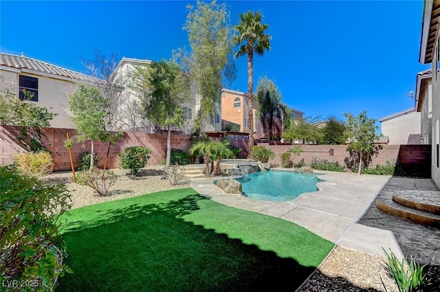 view of swimming pool with a yard, a patio, a fenced backyard, and a fenced in pool