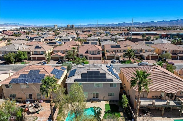 birds eye view of property with a mountain view and a residential view