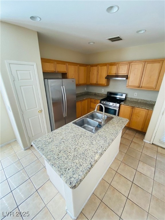 kitchen with light tile patterned floors, appliances with stainless steel finishes, a sink, and visible vents