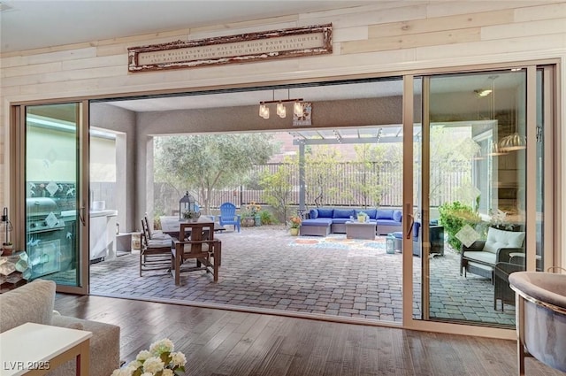 interior space featuring wooden walls and wood finished floors