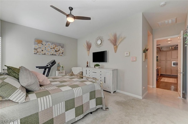 bedroom featuring light carpet, baseboards, visible vents, and ceiling fan