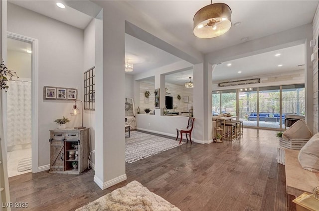 foyer featuring recessed lighting, baseboards, and wood finished floors