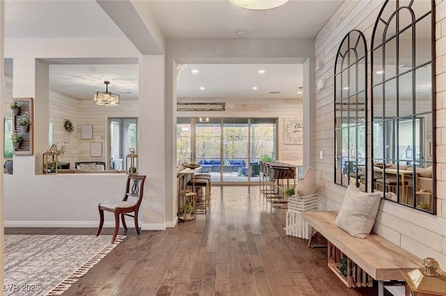 interior space with baseboards and wood finished floors