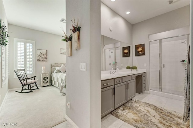 bathroom featuring visible vents, baseboards, tile patterned flooring, vanity, and a shower stall