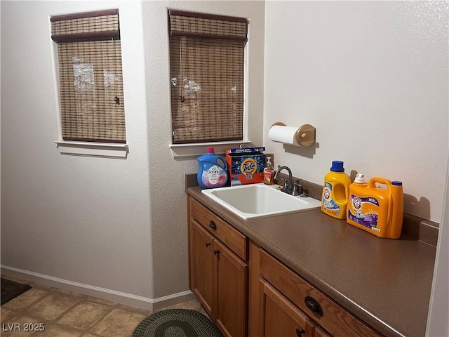 bathroom featuring vanity and baseboards