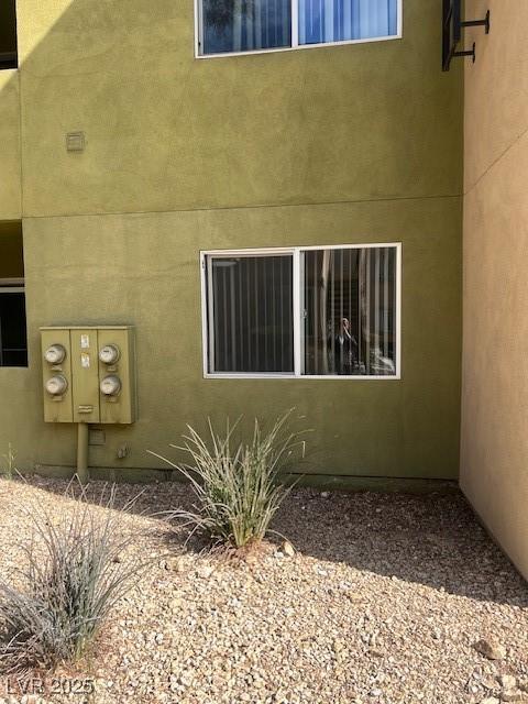 view of side of property featuring mail area