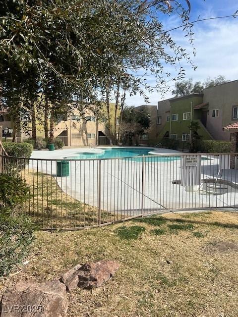 community pool featuring fence