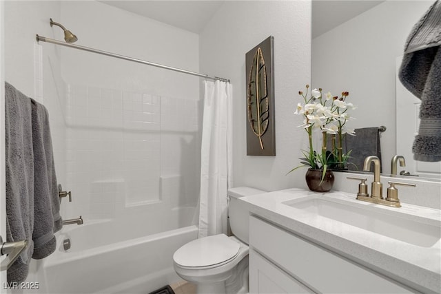 bathroom with toilet, shower / bath combo, and vanity