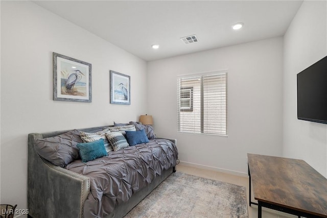 living area with recessed lighting, visible vents, baseboards, and tile patterned floors