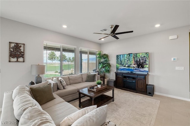 living area featuring a ceiling fan, recessed lighting, visible vents, and baseboards