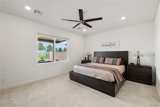 carpeted bedroom featuring ceiling fan, visible vents, and recessed lighting