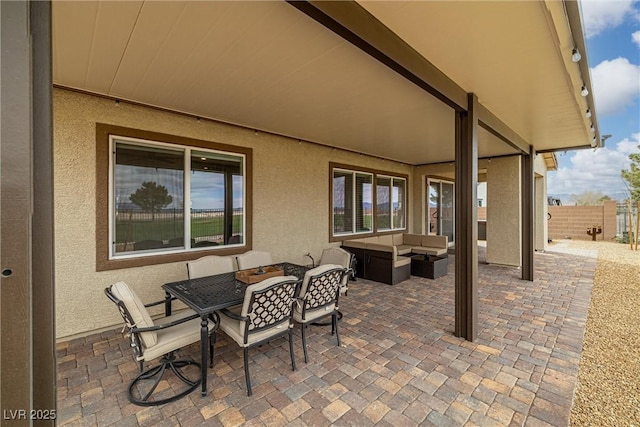 view of patio / terrace featuring fence and an outdoor living space