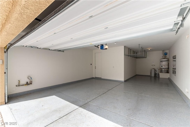 garage with baseboards, secured water heater, and a garage door opener