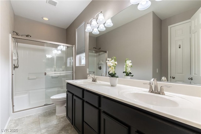 full bathroom featuring a stall shower, visible vents, and a sink