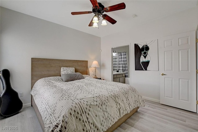 bedroom with baseboards, ceiling fan, and light wood finished floors