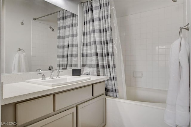 bathroom with shower / tub combo with curtain and vanity