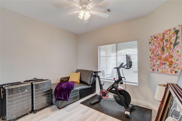 exercise area with ceiling fan, wood finished floors, visible vents, and baseboards