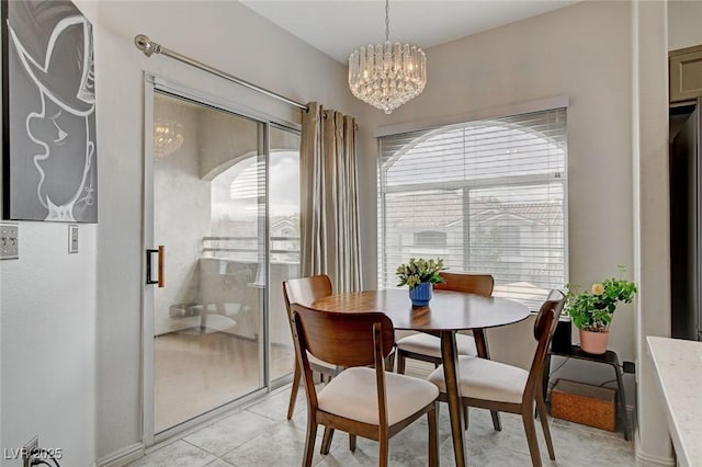 dining space with arched walkways and an inviting chandelier