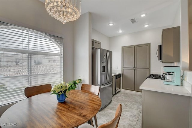 dining space featuring a chandelier, light tile patterned floors, visible vents, and recessed lighting