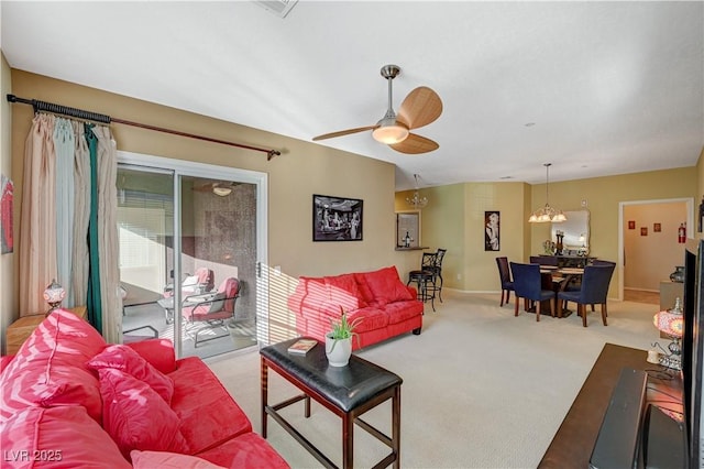 living area with carpet flooring and ceiling fan