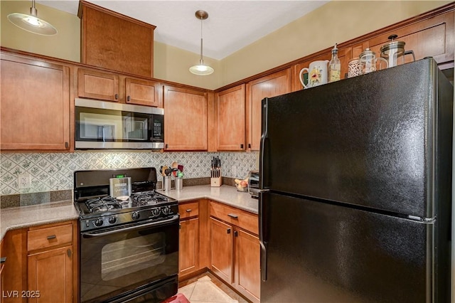 kitchen with black appliances, decorative backsplash, light countertops, and brown cabinetry