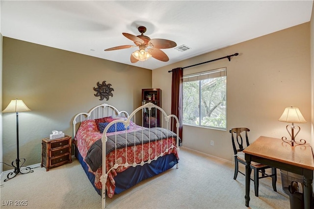 bedroom with carpet floors, baseboards, visible vents, and a ceiling fan