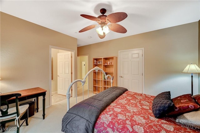 bedroom with light carpet, ceiling fan, and baseboards