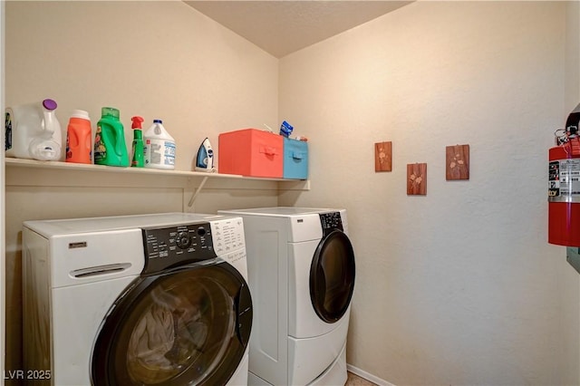 laundry area featuring laundry area, independent washer and dryer, and baseboards