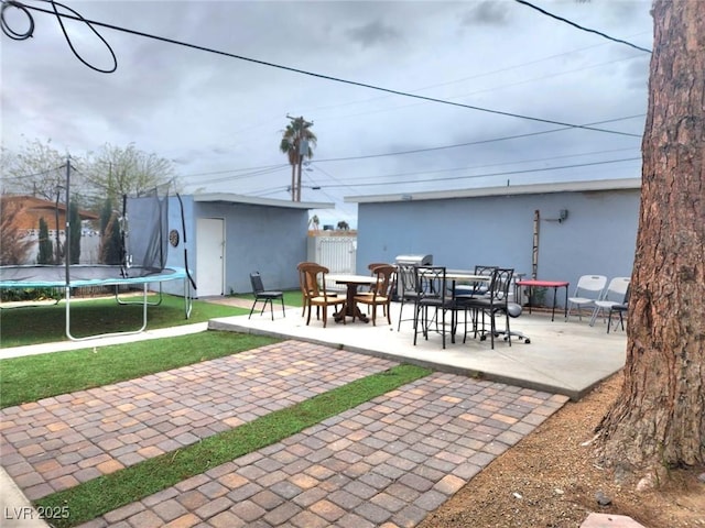 view of patio / terrace featuring a trampoline and an outdoor structure