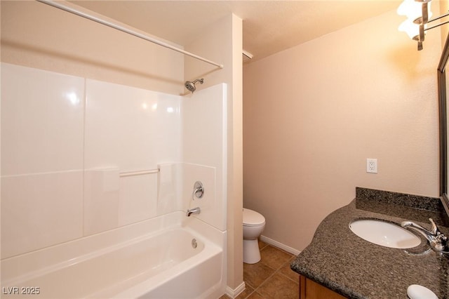 full bath with toilet, vanity, baseboards, tub / shower combination, and tile patterned floors