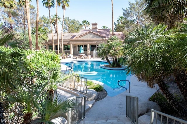 pool with a patio area