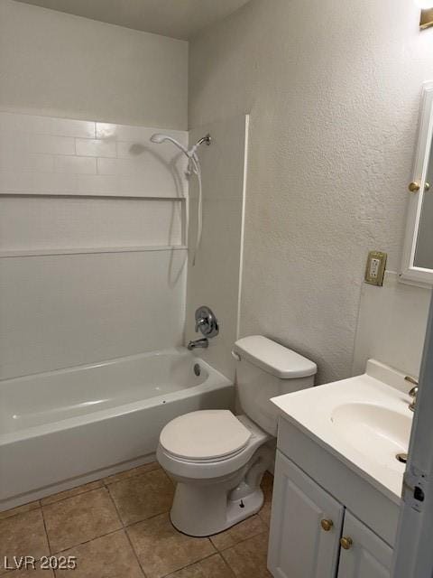 bathroom featuring a textured wall, toilet, tile patterned flooring, vanity, and shower / washtub combination