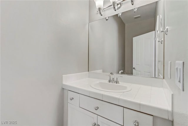 bathroom featuring visible vents and vanity