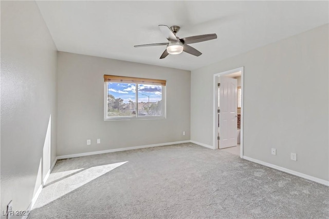 interior space with carpet floors, ceiling fan, and baseboards