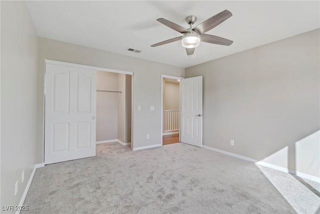 unfurnished bedroom featuring visible vents, baseboards, ceiling fan, carpet, and a closet