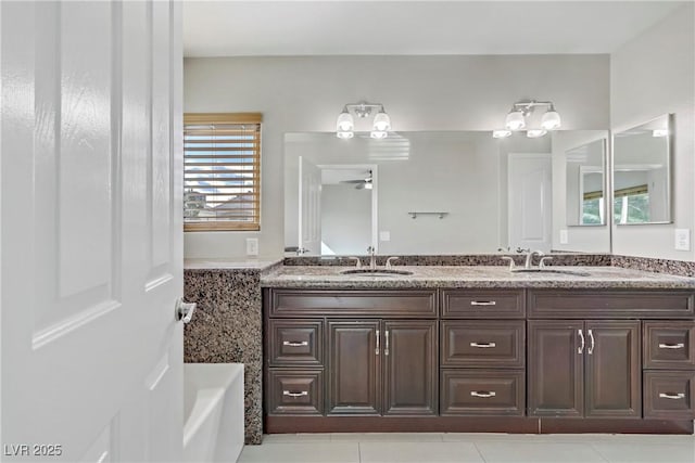 7973 Macklin St, Las Vegas, NV 89129 - full bathroom with tile patterned floors, double vanity, and a sink