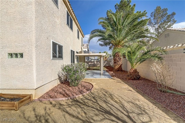 view of yard featuring a patio and a fenced backyard