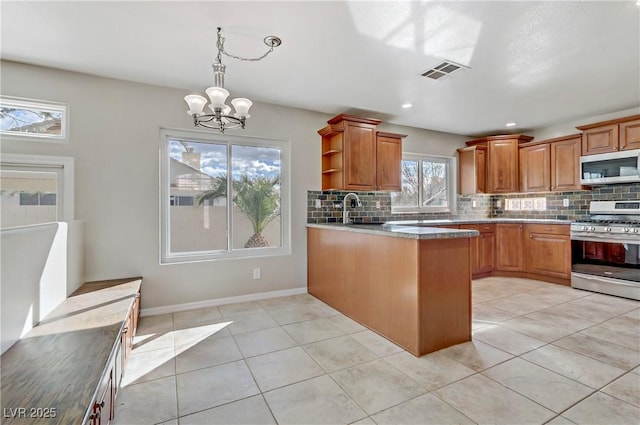 kitchen featuring open shelves, visible vents, backsplash, appliances with stainless steel finishes, and a peninsula