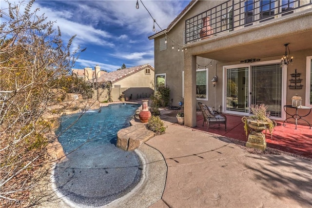 view of swimming pool with a patio area and a fenced in pool