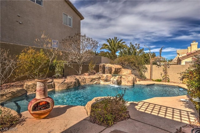 view of pool featuring a patio, a fenced backyard, and a fenced in pool