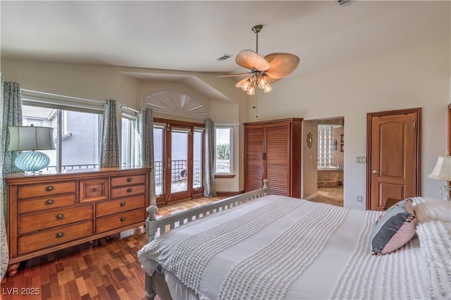 bedroom featuring access to exterior, dark wood finished floors, visible vents, a ceiling fan, and connected bathroom