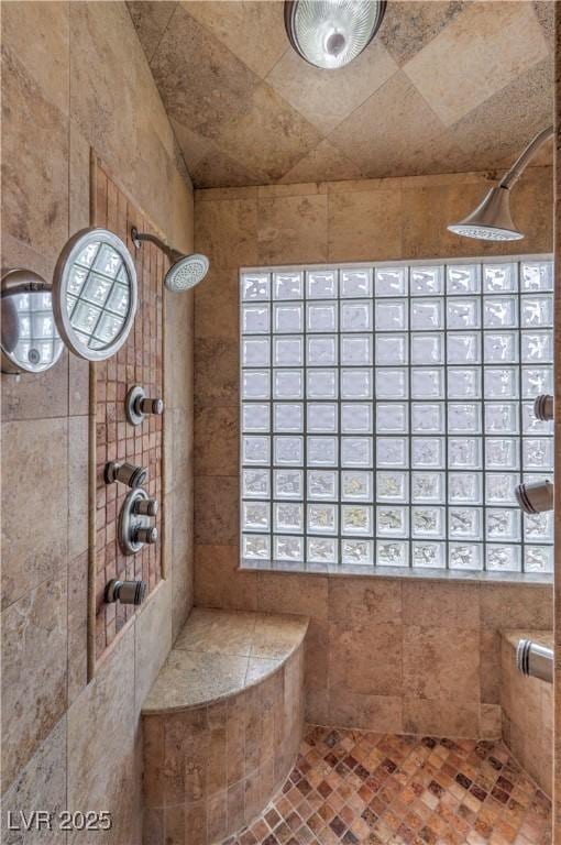 bathroom with a tile shower