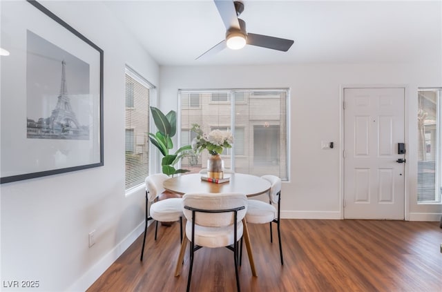 dining area featuring ceiling fan, wood finished floors, and baseboards