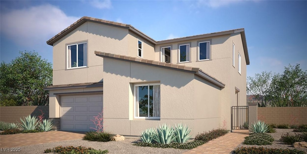 view of side of property featuring a garage, decorative driveway, fence, and stucco siding